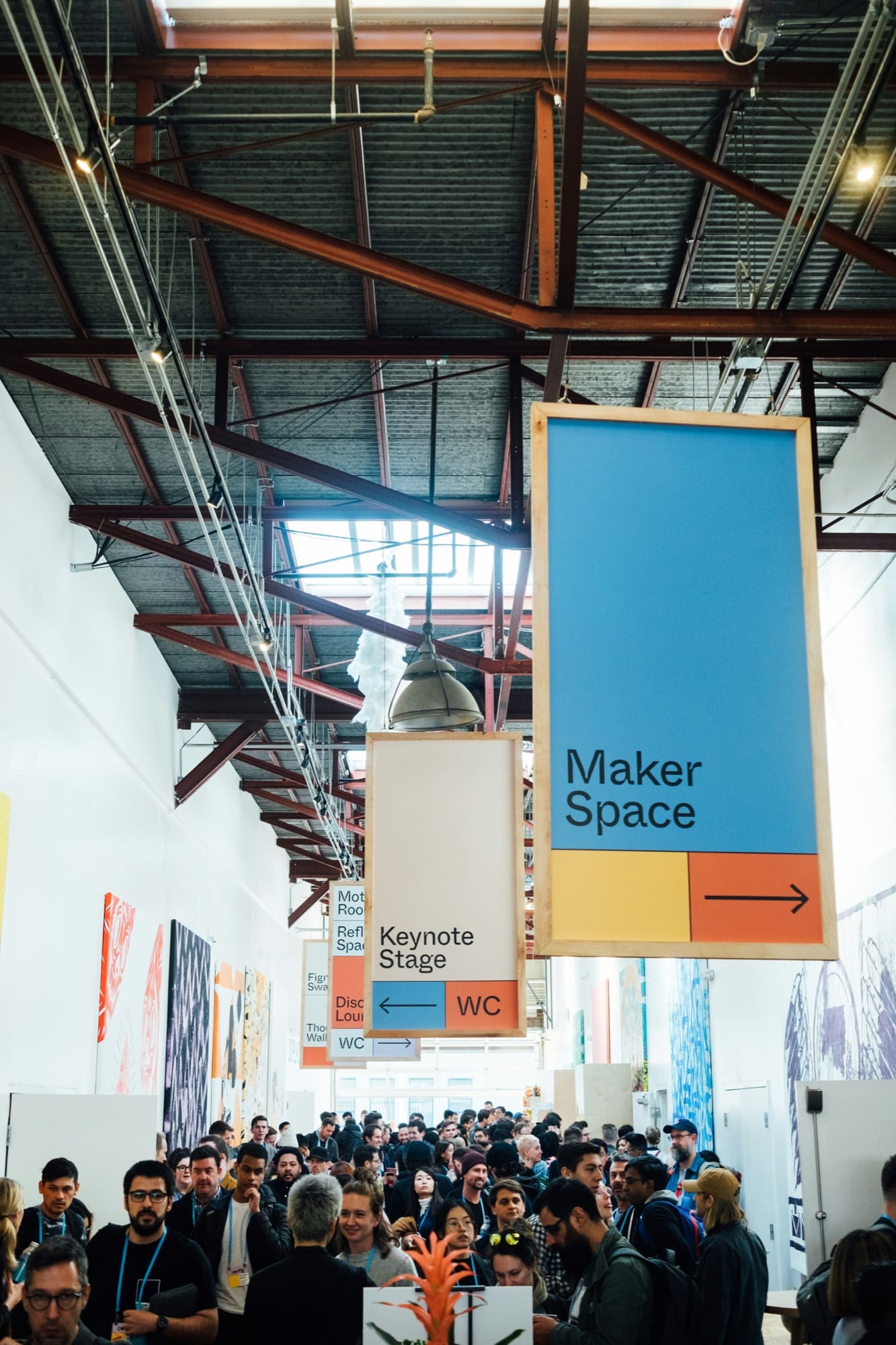 A gathering of people sharing ideas in an active makerspace